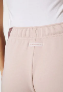 Nike Sportswear Air - Tracksuit Bottoms - Fossil Stone/Plum Eclipse -Esprid Shop ee2fb25cce144aa691aaa85032260970 scaled